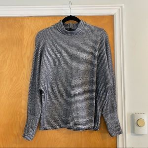 Urban Outfitters mock neck out from under sweater